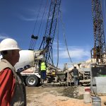 Watchful eye of contractor Bob Black as the last of the pilings installed.